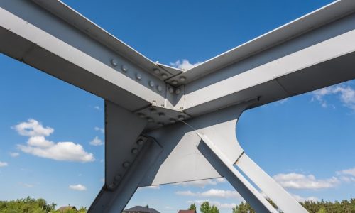 iron-steel-frame-construction-bridge-blue-sky-background-bridge-metal-structures-frames-bolts-nuts_97694-11760